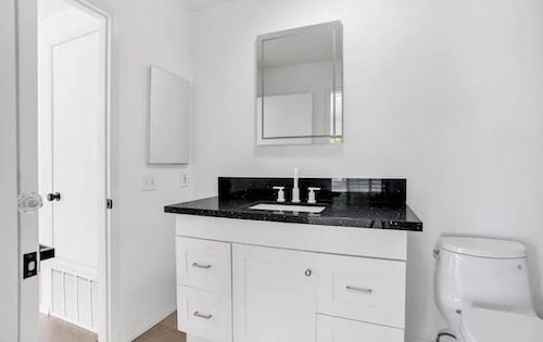 Modern bathroom remodel and renovation completed in a Southern California house by Exclusive SoCal Home Buyers.