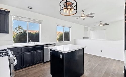 Fully renovated modern kitchen featuring updated cabinetry and quartz countertops in a Southern California home by Exclusive SoCal Home Buyers.