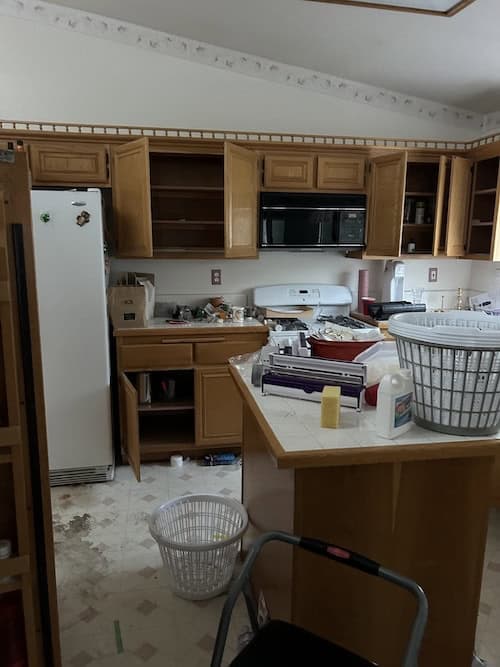 Damaged flooring in a Southern California house before being repaired and renovated by Exclusive SoCal Home Buyers.